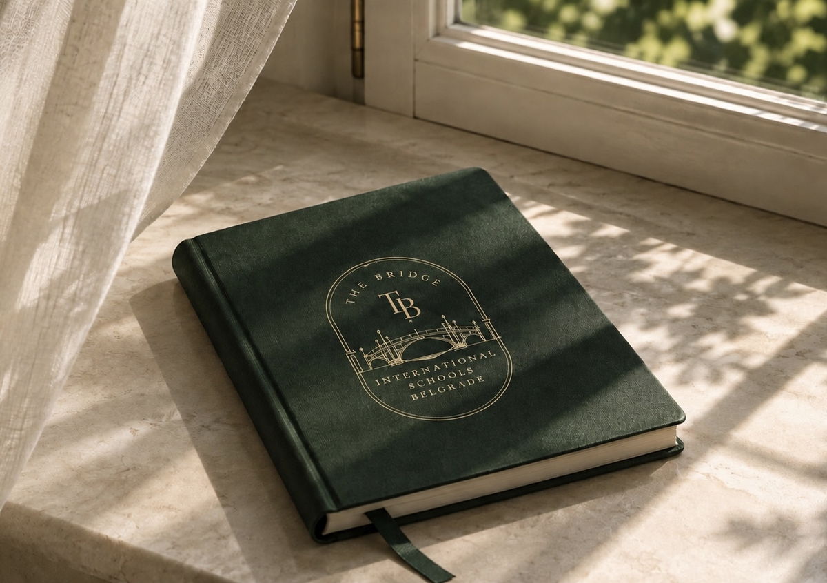 The Bridge notebook resting on a sunlit windowsill