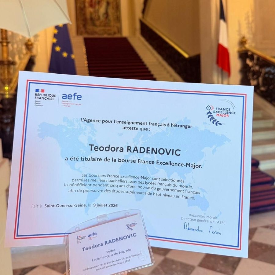 A France Excellence-Major scholarship certificate awarded to a school leaver, photographed in the hall